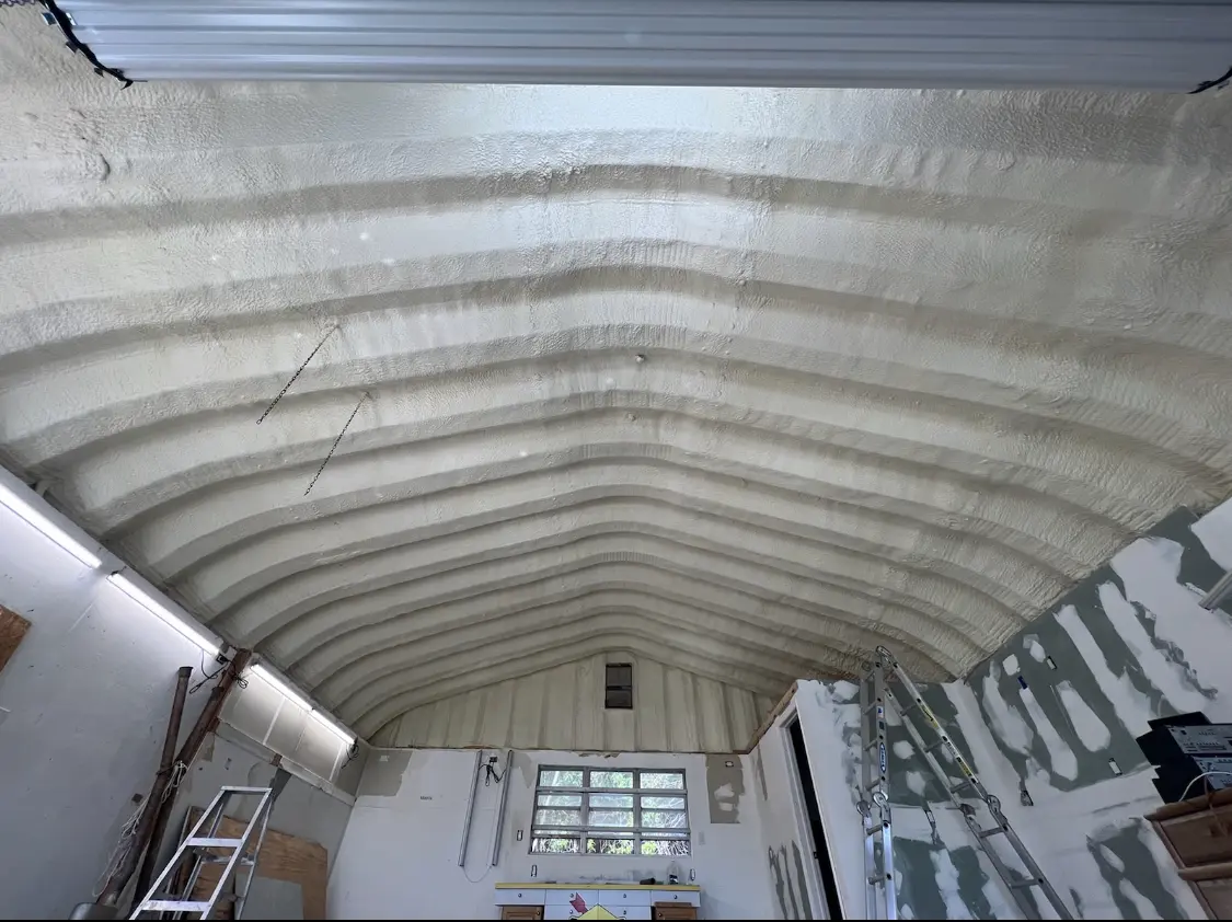 Spray polyurethane foam applied to the underside of a metal roof deck in Annville